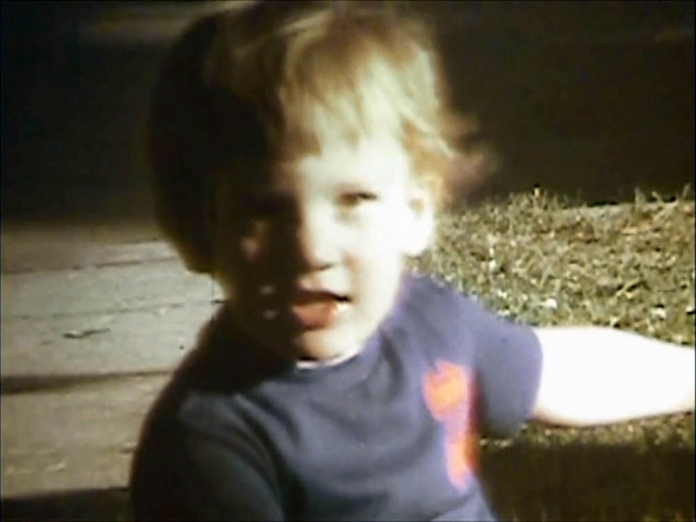 noah on trike in front yard