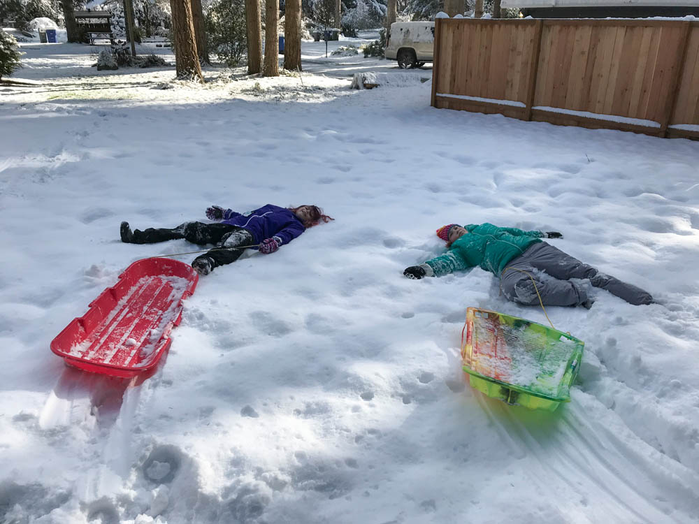 february_katie and maddy sledding