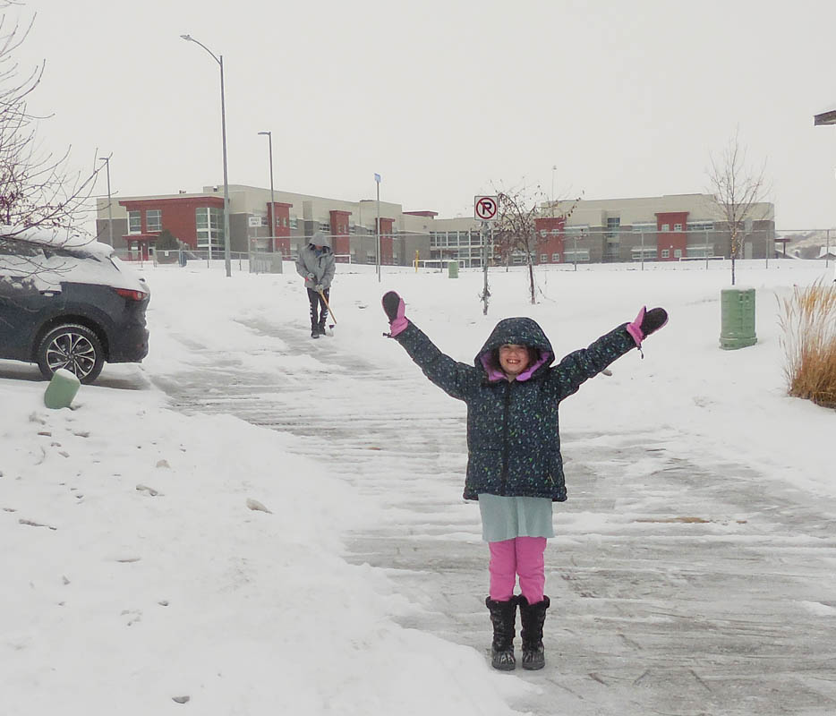 december_mandy and noah shoveling snow